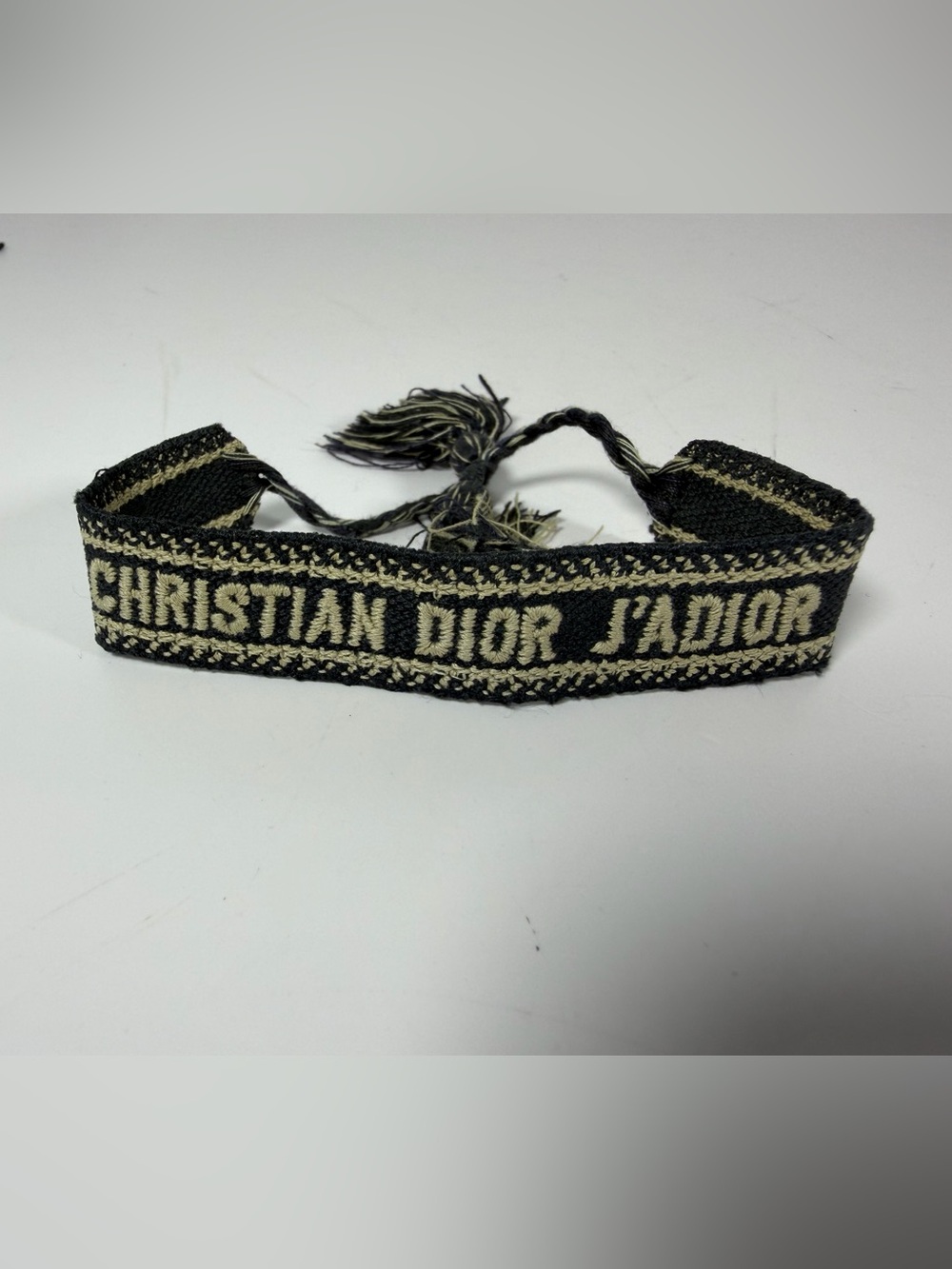 9038: Christian Dior J’Adior Woven Friendship Bracelet Black Gold Tassels